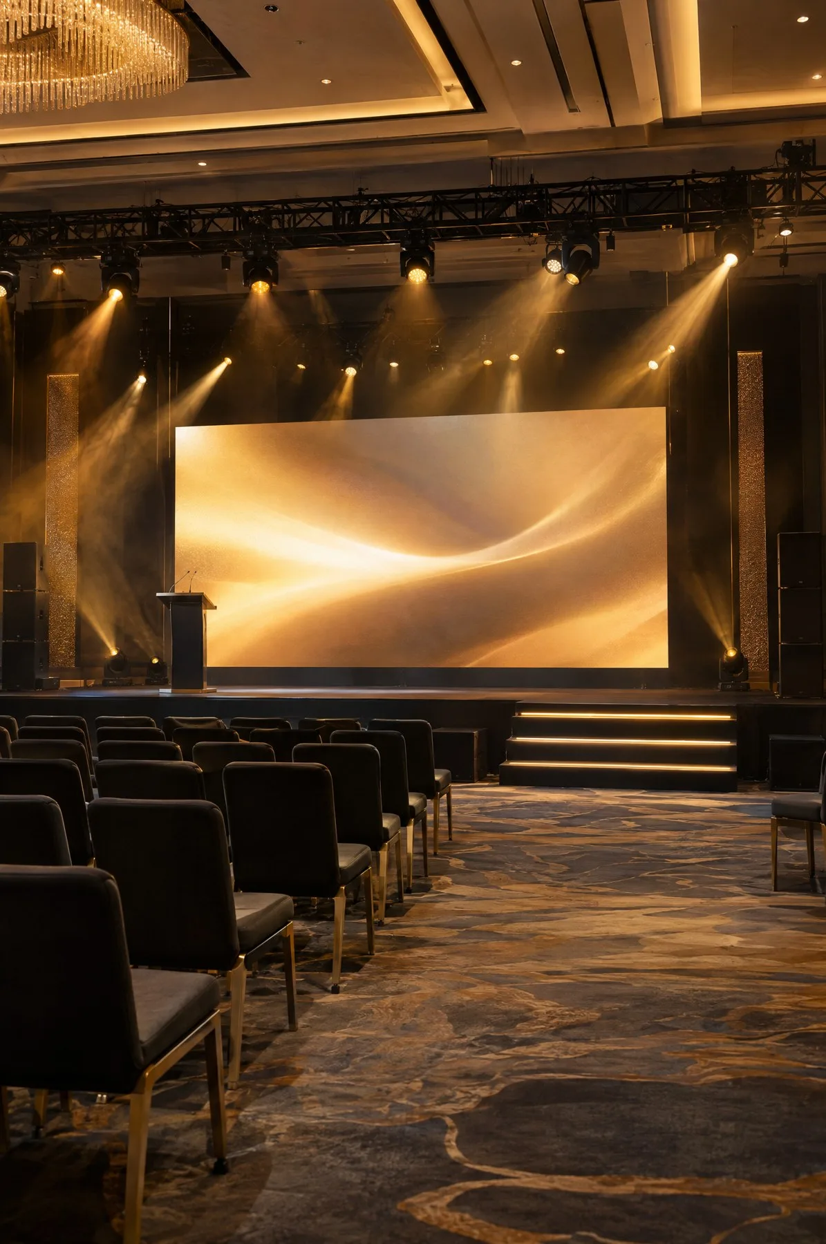 An event stage set up with a screen and lighting